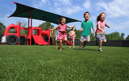 Happy kids playing on XGrass playground grass