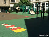 City park playground installed with colorful poured-in-place rubber surfacing