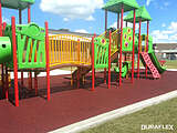 Poured-in-place rubber surfacing underneath jungly gym playset