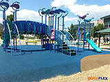 School playground with blue poured-in-place rubber surfacing