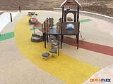 Park playground with rubber playground surface installed