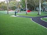 Park with artificial grass and bonded rubber walkways